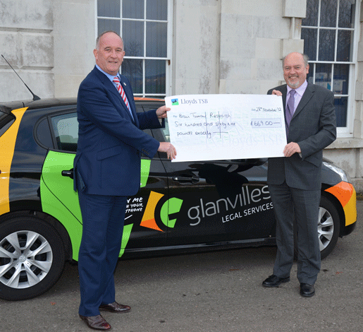 Two men holding large cheque from Lloyds TSB for Brain Tumour Research
